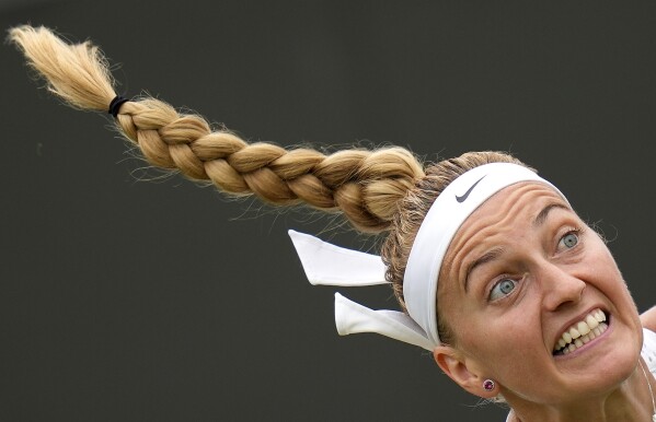 Czech Republic's Petra Kvitova serves to Serbia's Natalija Stevanovic in a women's singles match on day six of the Wimbledon tennis championships in London, Saturday, July 8, 2023. (AP Photo/Kirsty Wigglesworth)