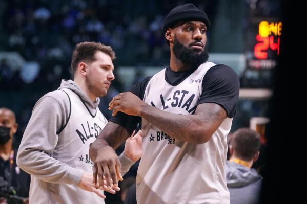 Los Angeles Lakers forward LeBron James, right, and Dallas Mavericks forward Luka Doncic workout during a practice session for the NBA All-Star basketball game in Cleveland, Saturday, Feb. 19, 2022. (AP Photo/Charles Krupa)