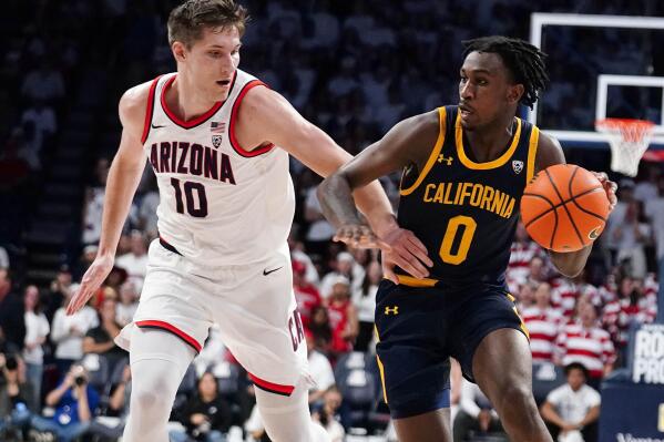 Arizona's Azuolas Tubelis (10) pressures California's Marsalis Robertson (0) during the first half of an NCAA college basketball game, Sunday, Dec. 4, 2022, in Tucson, Ariz. (AP Photo/Darryl Webb)