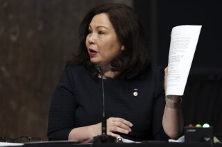FILE - In this May 6, 2020, file photo, Sen. Tammy Duckworth, D-Ill., speaks during a hearing on Capitol Hill in Washington. Duckworth says the lack of Asian American or Pacific Islander representation in President Joe Biden’s cabinet is “not acceptable” and is threatening to withhold her vote on key nominations until the administration addresses the matter. (Greg Nash/Pool via AP)