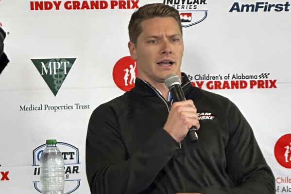 Reigning Indianapolis 500 champion Josef Newgarden talks in Birmingham, Ala., Friday, April 26, 2024, about his recent disqualification in the season-opening IndyCar auto race. Newgarden is preparing for Sunday's race at Birmingham's Barber Motorsports Park. (AP Photo/John Zenor)