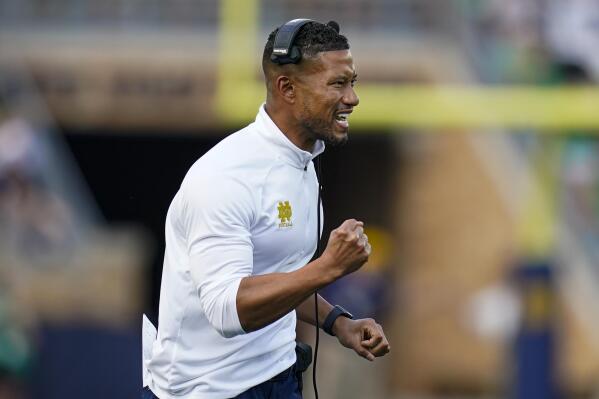FILE - Notre Dame head coach Marcus Freeman celebrates a touchdown during the second half of an NCAA college football game against California in South Bend, Ind., Saturday, Sept. 17, 2022. No. 19 Notre Dame faces 20th-ranked South Carolina in the Gator Bowl. (AP Photo/Michael Conroy, File)