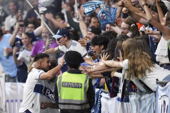 Vancouver Whitecaps' Lucas Cavallini celebrates with fans after his goal against Austin FC during the second half of an MLS soccer match Saturday, Oct. 1, 2022, in Vancouver, British Columbia. (Darryl Dyck/The Canadian Press via AP)