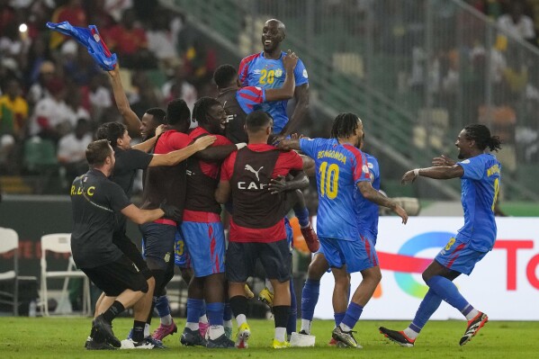 DR Congo's Arthur Masuaku celebrates with teammates after scoring his side's third goal during the African Cup of Nations quarter final soccer match between DR Congo and Guinea, at the Olympic Stadium of Ebimpe in Abidjan, Ivory Coast, Friday, Feb. 2, 2024. (APPhoto/Themba Hadebe)