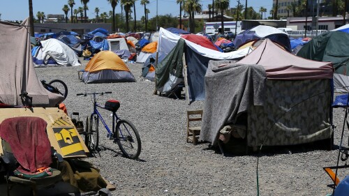 FILE - A large homeless encampment is shown in Phoenix, on Aug. 5, 2020. The city of Phoenix is scheduled go to court Monday, July 10, 2023, to prove it has met a deadline to clear a large homeless encampment, an action that has drawn pushback from civil rights advocates. (AP Photo/Ross D. Franklin, File)
