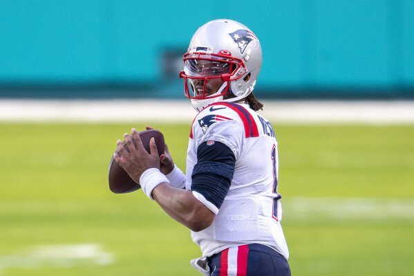 FILE - New England Patriots quarterback Cam Newton (1) looks to throw the ball against the Miami Dolphins during an NFL football game in Miami Gardens, Fla., in this Sunday, Dec. 20, 2020, file photo. Washington’s biggest offseason need is to figure out its quarterback situation. Trade for DeShaun Watson? Sign Cam Newton? Roll with Alex Smith and Kyle Allen? Coach Ron Rivera says “nothing is off the table.” (AP Photo/Doug Murray, File)