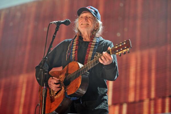 FILE - Willie Nelson performs at Farm Aid 30 at FirstMerit Bank Pavilion at Northerly Island in Chicago on Sept. 19, 2015. Nelson is turning 90 this year and he's celebrating with an all-star, two-day concert in Los Angeles this April. The Texas troubadour's milestone birthday party at the Hollywood Bowl will feature dozens of performers, including Neil Young, Chris Stapleton, Miranda Lambert, and Snoop Dogg. (Photo by Rob Grabowski/Invision/AP, File)
