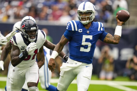 Indianapolis Colts quarterback Anthony Richardson (5) is pursued by Houston Texans defensive end Will Anderson Jr. (51) in the first half of an NFL football game in Houston, Sunday, Sept. 17, 2023. (AP Photo/Eric Christian Smith)