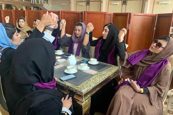 Women gather to demand their rights under the Taliban rule during a protest in Kabul, Afghanistan, Saturday, Sept. 4, 2021. The Taliban have promised an inclusive government and a more moderate form of Islamic rule than when they last ruled the country from 1996 to 2001. But many Afghans, especially women, are deeply skeptical and fear a rollback of rights gained over the last two decades. (AP Photo/Kathy Gannon)