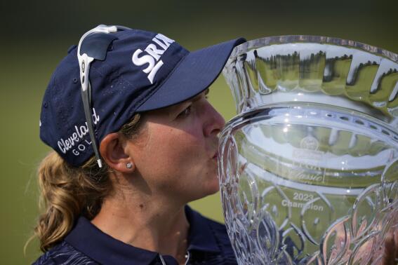 Ashleigh Buhai, of South Africa, poses with the trophy after winning the ShopRite LPGA Classic golf tournament, Sunday, June 11, 2023, in Galloway, N.J. (AP Photo/Matt Slocum)