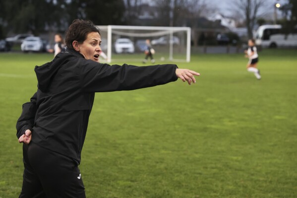 Youth coach Tarena Ranui gives directions during a girls soccer game in Hamilton, New Zealand, Monday, July 24, 2023. Maori youth coach, Ranui, is among those leading the charge to change the landscape of soccer in New Zealand. (AP Photo/Luke Vargas)