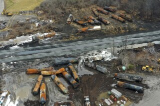 FILE - Cleanup of portions of a Norfolk Southern freight train that derailed Friday night in East Palestine, Ohio, continues on Feb. 9, 2023. (AP Photo/Gene J. Puskar, File)