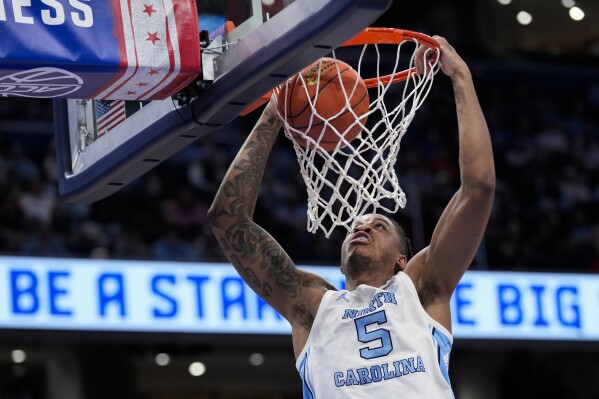 North Carolina forward Armando Bacot dunks during the first half of an NCAA college basketball game against Florida State in the quarterfinal round of the Atlantic Coast Conference tournament, Thursday, March 14, 2024, in Washington. (AP Photo/Susan Walsh)