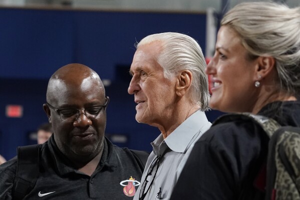 Miami Heat president Pat Riley talks to his staff during an NBA basketball training camp, Wednesday, Oct. 4, 2023, in Boca Raton, Fla. (AP Photo/Marta Lavandier)