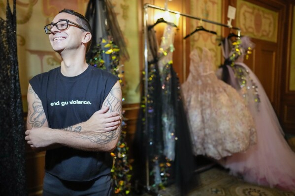 Designer Christian Siriano smiles during an interview backstage before his collection is modeled during Fashion Week, Friday, Sept. 8, 2023, in New York. (AP Photo/Mary Altaffer)