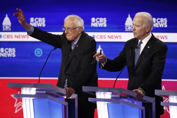From left, Democratic presidential candidates Sen. Bernie Sanders, I-Vt., and former Vice President Joe Biden participate in a Democratic presidential primary debate at the Gaillard Center, Tuesday, Feb. 25, 2020, in Charleston, S.C., co-hosted by CBS News and the Congressional Black Caucus Institute. (AP Photo/Patrick Semansky)