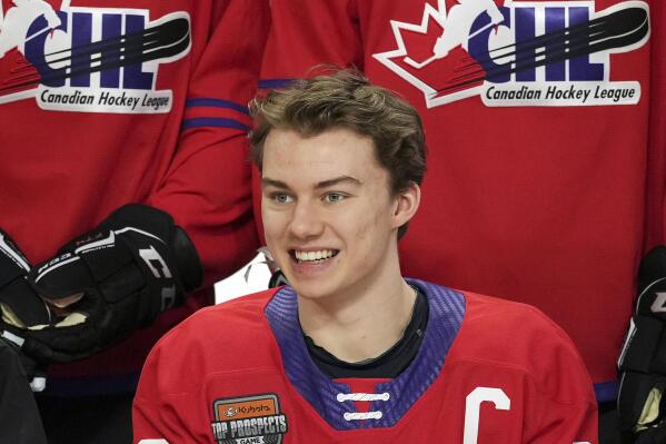 FILE - Regina Pats' Connor Bedard smiles for a team photo ahead of the CHL/NHL Top Prospects game, in Langley, British Columbia, Wednesday, Jan. 25, 2023. The NHL draft lottery is drawn, determining which team gets the chance to select Connor Bedard with the No. 1 pick. The Anaheim Ducks, Columbus Blue Jackets and Chicago Blackhawks have the highest odds of landing the most anticipated top pick since Connor McDavid in 2015. (Darryl Dyck/The Canadian Press via AP, File)