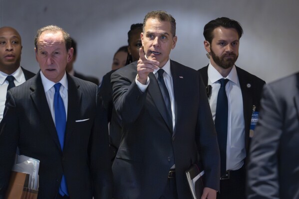 Hunter Biden, son of President Joe Biden, with attorney Abbe Lowell, left, leaves after a closed-door deposition in the Republican-led investigation into the Biden family, on Capitol Hill in Washington, Wednesday, Feb. 28, 2024. (AP Photo/J. Scott Applewhite)