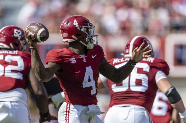 Alabama quarterback Jalen Milroe (4) throws a pass against Mississippi during the first half of an NCAA college football game, Saturday, Sept. 23, 2023, in Tuscaloosa, Ala. (AP Photo/Vasha Hunt)