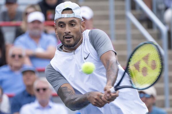 Australia's Nick Kyrgios returns to Poland's Hubert Hurkacz during the quarterfinals of the National Bank Open tennis tournament on Friday, Aug. 12, 2022, in Montreal. (Paul Chiasson/The Canadian Press via AP)
