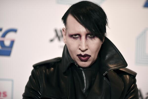FILE - Marilyn Manson attends the 9th annual "Home for the Holidays" benefit concert on Dec. 10, 2019, in Los Angeles. Manson sued his former fiancee, “Westworld" actor Evan Rachel Wood, on Wednesday, March 2, 2022, over her allegations that he sexually and physically abused her during their relationship. Wood and Manson broke up in 2010. (Photo by Richard Shotwell/Invision/AP, File)