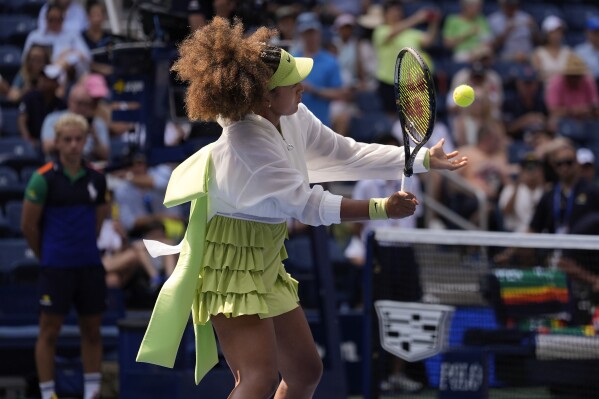Naomi Osaka, of Japan, warms up before playing against Jelena Ostapenko, of Latvia, during the first round of the U.S. Open tennis championships, Tuesday, Aug. 27, 2024, in New York. (AP Photo/Seth Wenig)