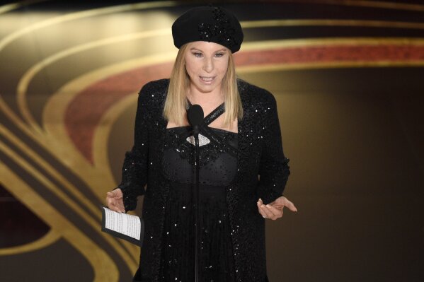 
              FILE - In this Feb. 24, 2019 file photo, Barbra Streisand introduces "BlacKkKlansman" at the Oscars at the Dolby Theatre in Los Angeles. Streisand is coming under intense criticism online for telling a British newspaper that two men who say they were molested as children by Michael Jackson were “thrilled to be there” and that the alleged abuse “didn’t kill them.” In a wide-ranging interview with the Times of London, Streisand was quoted as saying she “absolutely” believed the accusers. Wade Robson and James Safechuck make their allegations in the HBO documentary “Leaving Neverland.”(Photo by Chris Pizzello/Invision/AP, File)
            