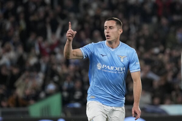 Lazio's Adam Marusic celebrates after scoring his side's opening goal during the Serie A soccer match between Lazio and Juventus at Rome's Olympic Stadium, Saturday, March 30, 2024. (AP Photo/Andrew Medichini)