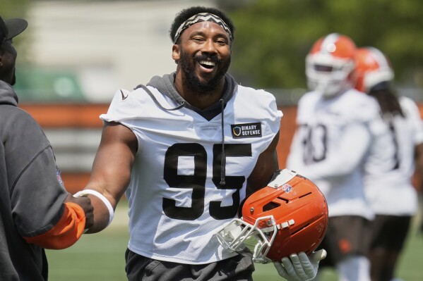 Cleveland Browns defensive end Myles Garrett (95) laughs at NFL football minicamp in Berea, Ohio, Tuesday, June 10, 2025. (AP Photo/Sue Ogrocki)