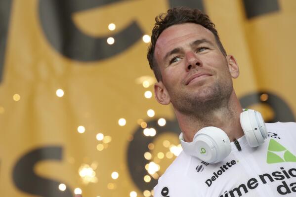 FILE - In this Thursday, July 5, 2018 file photo, Britain's sprinter Mark Cavendish listens during the Tour de France cycling race team presentation in La Roche-sur-Yon, Vendee region, France, ahead of Saturday's start of the race. Veteran sprinter Mark Cavendish will make his return to the Tour de France after a three-year absence from cycling's biggest event, his team said on Monday June 21, 2021. (AP Photo/Christophe Ena, File)