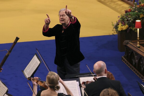 FILE - Conductor John Eliot Gardiner leads musicians as they perform in Westminster Abbey, ahead of the coronation of King Charles III and Camilla, the Queen Consort, in London, Saturday, May 6, 2023. Prominent classical music conductor John Eliot Gardiner is pulling out of all engagements until next year after allegedly hitting a singer backstage following a concert. The British conductor said in a statement on Thursday, Aug. 31, 2023 that he was stepping back to obtain “the specialist help I recognize that I have needed for some time.” (Richard Pohle /Pool via AP, File)