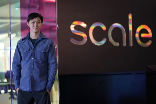 Scale AI founder and CEO Alexandr Wang poses for photos at the company's office in San Francisco, May 15, 2023. (AP Photo/Jeff Chiu, File)