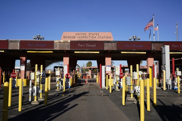 FILE - The border crossing sits closed Dec. 15, 2023, at Lukeville, Ariz. U.S. authorities say the crossing on the most direct route from Phoenix to the nearest beaches will reopen Thursday, Jan. 4, 2024, one month after it closed in response to a large migrant influx. (AP Photo/Gregory Bull, File)
