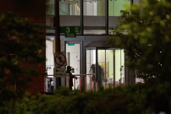 Law enforcement work the scene after two staff members of the Israeli Embassy in Washington were shot and killed outside the Capital Jewish Museum, Thursday, May 22, 2025, in Washington. (AP Photo/Rod Lamkey, Jr.)