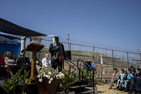 Formerly incarcerated student and valedictorian Michael Love speaks during a graduation ceremony at Folsom State Prison in Folsom, Calif., Thursday, May 25, 2023. After serving more than 35 years in prison, the 55-year-old is currently enrolled in a Master's program at Sacramento State. He is employed by Project Rebound, an organization that assists and mentors formerly incarcerated people as they further their education. “You have just as much value as anyone in the community,” he told the other prisoners in his speech. “You are loved. I love you, that’s why I’m here.” (AP Photo/Jae C. Hong)