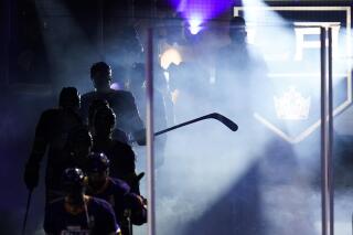 The Los Angeles Kings enter the ice at the start of the third period of an NHL hockey game against the Anaheim Ducks Monday, April 26, 2021, in Los Angeles. (AP Photo/Ashley Landis)