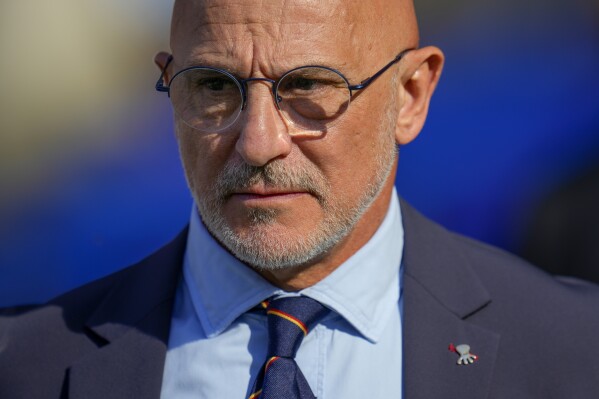 Spain's head coach Luis de la Fuente enters the pitch prior a Group B match between Spain and Croatia at the Euro 2024 soccer tournament in Berlin, Germany, Saturday, June 15, 2024. Spain defeated Croatia 3-0. (AP Photo/Manu Fernandez)