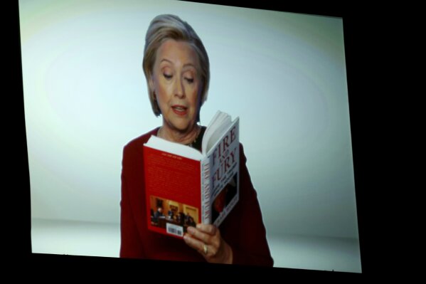 
              Hillary Clinton appears on screen reading an excerpt from the book "Fire and Fury" during a skit at the 60th annual Grammy Awards at Madison Square Garden on Sunday, Jan. 28, 2018, in New York. (Photo by Matt Sayles/Invision/AP)
            