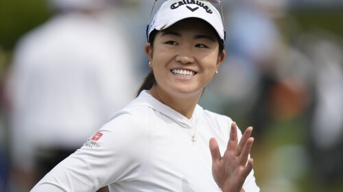 Rose Zhang waves on the driving range ahead of the Women's PGA Championship golf tournament, Wednesday, June 21, 2023, in Springfield, N.J. (AP Photo/Seth Wenig)