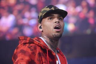 FILE - In this June 7, 2015 file photo, rapper Chris Brown performs at the 2015 Hot 97 Summer Jam at MetLife Stadium in East Rutherford, N.J. A Los Angeles judge on Wednesday, Dec. 4, 2019, said Brown must give up all rights to his former pet monkey, pay for its care and not try to buy a new one if he wants charges of illegal animal ownership dropped. Brown was allowed to enter a diversion program nearly a year after he was charged with two misdemeanors over his possession of a pet capuchin monkey without a permit. (Photo by Scott Roth/Invision/AP, File)