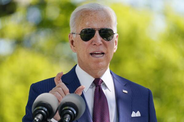 President Joe Biden responds to a question from reporters about COVID-19, on the North Lawn of the White House, Tuesday, April 27, 2021, in Washington. (AP Photo/Evan Vucci)