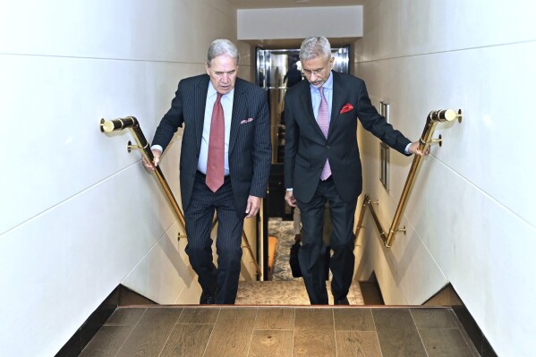 Indian Foreign Minister S. Jaishankar, right, climbs a staircase with New Zealand's Deputy Prime Minister and Foreign Minister Winston Peters in New Delhi, India, Thursday, May 29, 2025. (Indian Foreign Minister S. Jaishankar on X, via AP)