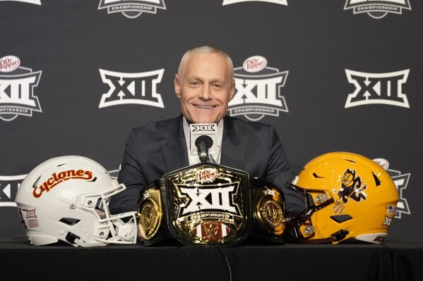 Big 12 Commissioner Brett Yormark responds to questions during a news conference before the Big 12 Conference championship NCAA college football game between Iowa State and Arizona State, in Arlington, Texas, Saturday Dec. 7, 2024. (AP Photo/LM Otero)
