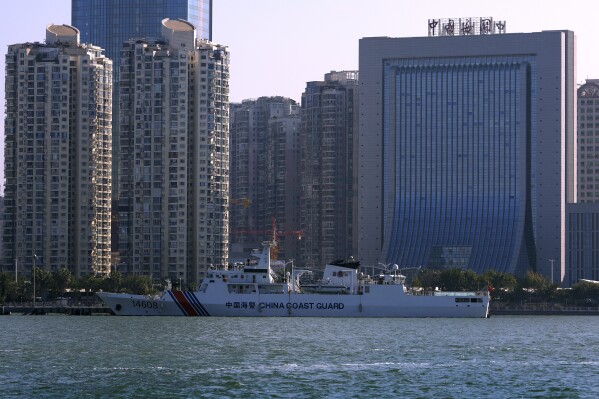 A Chinese Coast Guard ship is docked near a China Customs building in Xiamen in southeast China's Fujian province on Dec. 26, 2023. Taiwan on Tuesday, Feb. 20, 2024 protested China's boarding of a tourist boat, as tensions rise around the Kinmen archipelago, which lies a short distance off China's coast but is controlled by Taiwan. (APPhoto/Andy Wong)