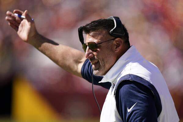 Tennessee Titans head coach Mike Vrabel speaks with an official in the first half of an NFL football game against the Washington Commanders, Sunday, Oct. 9, 2022, in Landover, Md. (AP Photo/Alex Brandon)