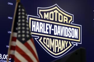 FILE - The logo for Harley-Davidson appears above a trading post on the floor of the New York Stock Exchange, March 3, 2020. Harley-Davidson shares fell more than 7% Thursday, May 19, 2022 after the motorcycle maker said it was suspending vehicle assembly and most shipments for two weeks due to a regulatory compliance issue with one of its suppliers. (AP Photo/Richard Drew)