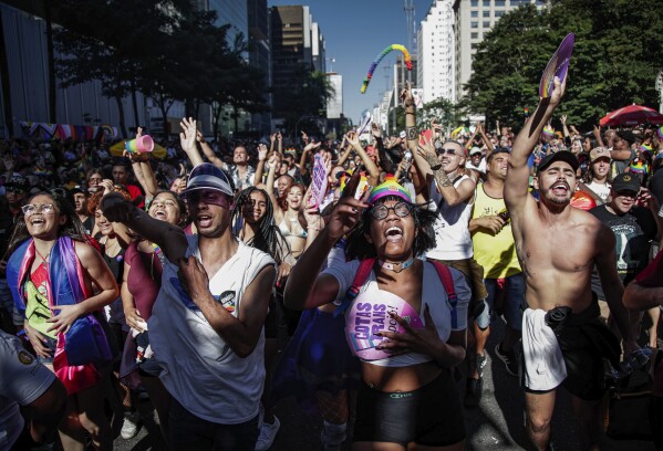 Participants dance during the annual Gay Pride Parade in Sao Paulo, Brazil, Sunday, June 11, 2023. (AP Photo/Tuane Fernandes)