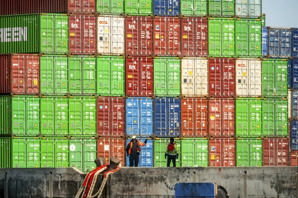 Dockworkers secure lines from a container ship at the Port of Oakland on April 4, 2025, in Oakland, Calif. (AP Photo/Noah Berger, File)