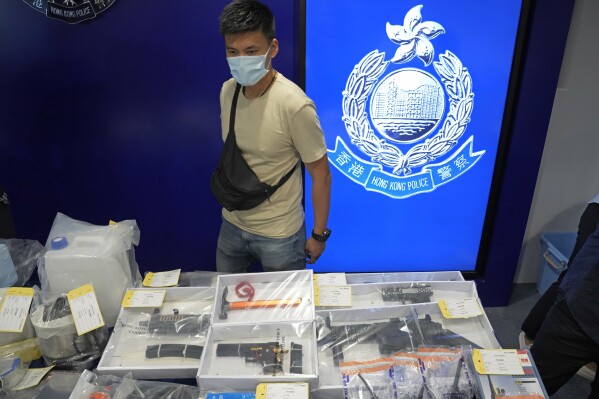 FILE - Confiscated evidence is displayed during a news conference as nine people were arrested over the alleged plot to plant bombs around Hong Kong, at the police headquarters in Hong Kong on July 6, 2021. A Hong Kong man was sentenced Thursday, Dec. 28, 2023 to six years in prison after pleading guilty to a terrorism charge under a Beijing-imposed national security law for his involvement in a foiled plot to bomb court buildings. (AP Photo/Kin Cheung, File)