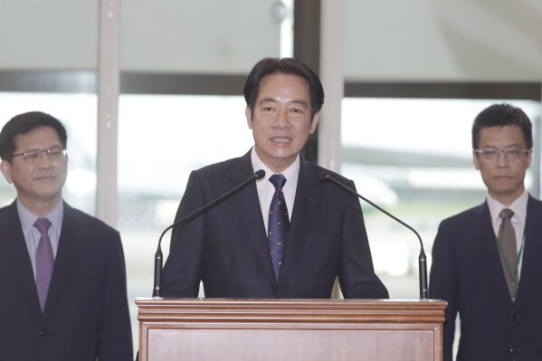 Taiwanese Vice President William Lai speaks before leaving for Paraguay at Taoyuan International Airport in Taoyuan, Taiwan, Saturday, Aug. 12, 2023. (AP Photo/Chiang Ying-ying)